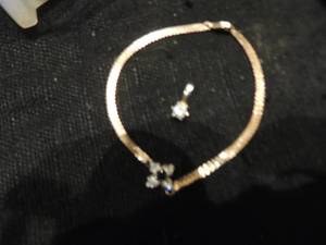 lot 235 image: gold 10 k gold bracelet, 1 diamond drop and 1 gold chain