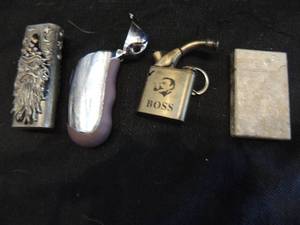 lot 88 image: 1 disposable lighter cover with wizard, one with closing case, boss pipe lighter keychain, butterfly lighter,