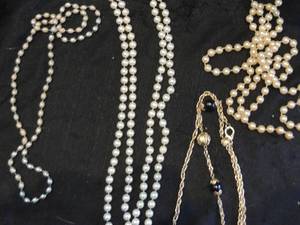 lot 86 image: 2 pearl like necklaces, other pearl like necklace  and blue and gold necklace