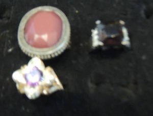 lot 99 image: 3 purple stone rings- square one is 8 other 2 are 7.5