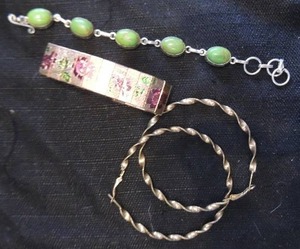 lot 72 image: 4 bracelets. 1 turquoise, 2 gold tone bangle and one  floral design