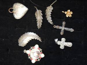 lot 75 image: 7 pieces- heart locket 2 drop crosses 3 gold tone leaves and 1 exquisite reversal drop with Mary on one side and Christ on the other