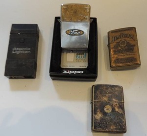 lot 60 image: Vintage - Ford zippo, Harley Davidson Zippo, Atomic lighter and Jim Beam zippo in original box