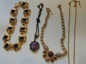 lot 70 image: 1 gold and black statement necklace, 1 stone statement necklace, 1 gold tone chain, and 1 vintage lapis look stone necklace