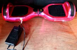 lot 111 image: YONGKANG LBW04A HOT PINK HOVERBOARD WITH CHARGER $$
