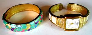 lot 396 image: PAIR OF BRACELETS, ONE BEING A STUDIO TIME WATCH