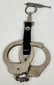 lot 36 image: Vintage Peerless Handcuff Company No. 905351 Handcuffs &amp Key