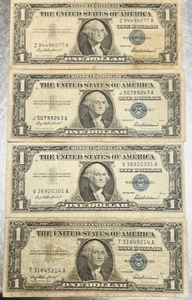 lot 44 image: Lot of 4 Series 1957 One Dollar Silver Certificates W Blue Seal