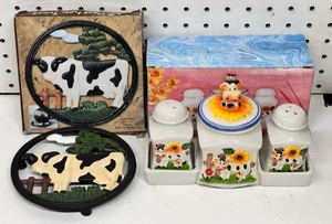 lot 66 image: Hand-Painted Cow Cast Iron Trivet &amp Cow Salt and Pepper Shakers With Sugar BowlShaker Holder