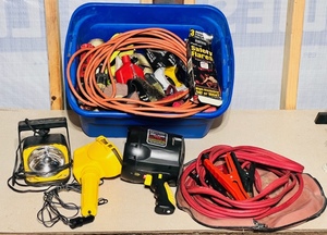 lot 141 image: Q Beams, Flashlights, Jumper Cables, Extension Cord, and Tote With Other Garage Items