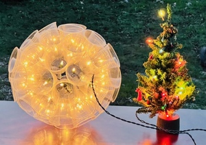 lot 183 image: One Mantle-Sized Lighted Christmas Tree &amp One Lighted Hanging Ball