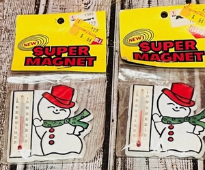 lot 302 image: Two (2) Vintage 1970s Super Magnet SnowmanThermometer Refrigerator Magnets