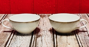 lot 310 image: Two (2) Vintage Royalton China Co. Translucent Porcelain Teacups With Gold Trim