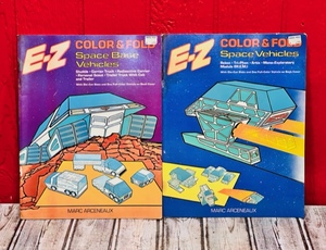 lot 315 image: 1983 Lot of 2 E-Z Color & Fold By Marc Arceneaux - Space Base Vehicles & Space Vehicles