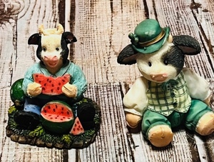lot 378 image: 1995 Enescos Erin Go Moo By Mary Rhyner & OUNG Cow Eating Watermelon