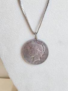 lot 174 image: 1935 Peace Dollar turned into a necklace