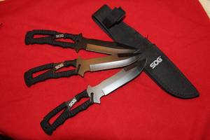 lot 5 image: Sog Knife, 3 Throwing Knives with matching Sheath