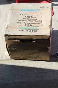 lot 98 image: 1000 ft roll of unopened coax cable .. see photos