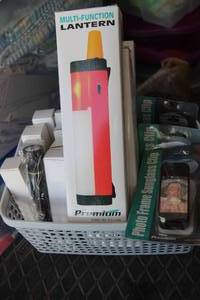 lot 105 image: Multi-function Lantern, Glasses Visor Clip, and small Flashlights as shown All New.