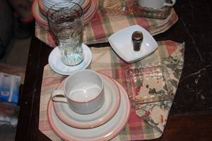 lot 122 image: set of Four, International Stoneware (mugs, saucers, and Desert plates) with matching Reversable placemats, Vintage Coke Glasses, more ... See Pictures