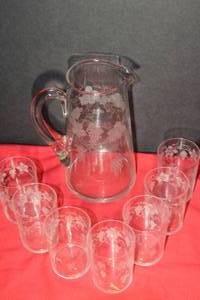 lot 124 image: Beautifully Etched Set of Juice Pitcher and Matching Juice Glasses ...