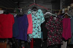 lot 148 image: Ladies Scrub Tob and Bottoms mostly xl in styles and colors as shown