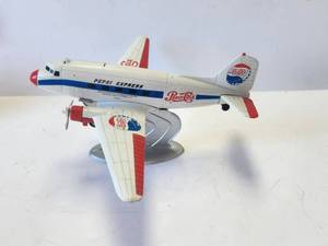 lot 38 image: Vintage cast Pepsi Cola airplane bank