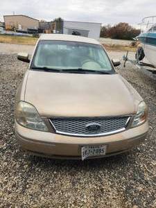 lot 1 image: 2007 Ford 500 - Has title and 1 key and fob - starts and runs fine- Has new battery, alternator, tie rods, 2 new 02 sensors, air filter, plugs, oil change - last passed inspection was on 822 Vin#1FAHP241X7G159483