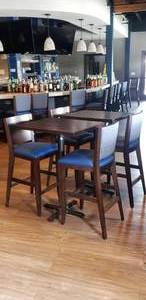 lot 81 image: 2 Sets of Tall Tables & Chairs.  Includes 2 Solid Wood Flat-Inside� Self Stabilizing Square Tables & 4 Matching Wooden Chairs