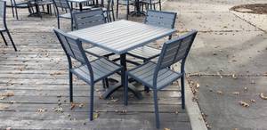 lot 31 image: 5-Piece ECCB Outdoor Patio Table & Chairs Set, Grey Poly Lumber & Metal.  Chairs Retail for $107 Each & Tables Retail for $279 Each