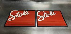 lot 343 image: Lot of 2 Stoli Stolichnaya Vodka Bar SplashDrip Mats