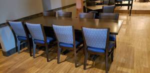 lot 404 image: 9-Piece Long Rectangle Table Set w 1 Solid Wood Flat-Inside� Self Stabilizing Table & 8 Matching Wooden Chairs