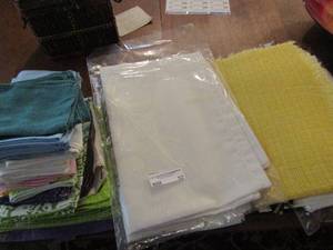 lot 52 image: Table cloths and new and used place settings, cloth napkins and more
