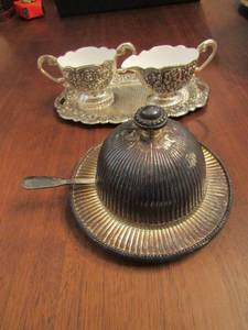 lot 56 image: Butter dish covered silver platted with spreader, silver platted handled sugar and creamer on plate