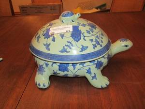 lot 61 image: 715 turtle dcor covered with feet, leaf design on it, For decoration only and holds popery inside