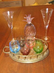 lot 65 image: 5 colored glass mini shot glasses on a gold platted trey, 6  wine glasses, SD Simone clear glass pineapple