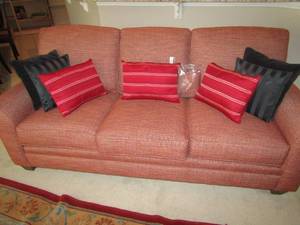 lot 82 image: Stacey furniture Kirkwood design couch, built in cushions like new, off red color very comfy