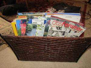 lot 204 image: Wicker magazine rack with various types of magazines