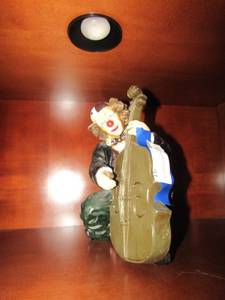 lot 91 image: Clown playing cello, 10x7