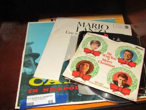 lot 95 image: 45s and Laps ,  Christmas songs,  with book- German songs and more. Lebombo rock core ad tom hosier