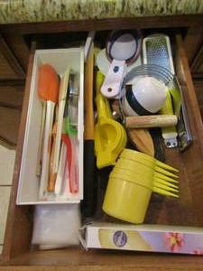 lot 215 image: pastry making utensils, cheese shredders, measuring cups, ladles and more