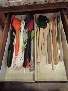lot 217 image: Drawer full of cooking utensils such as wooden and plastic spoons