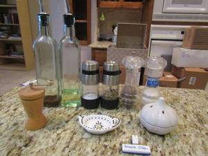 lot 202 image: Vinegar and oil DE canister bottles, various salt and pepper shakers grinders, garlic holder and more
