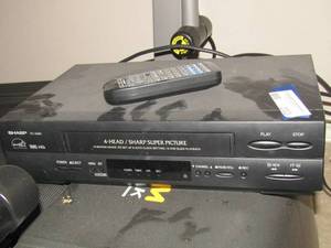 lot 232 image: Sharp vs. tape player, no remote found, unknown if works