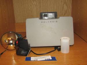 lot 248 image: vintage polaroid camera and a blue light flash