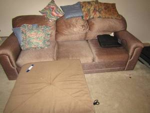 lot 118 image: Hide-A-Bed - Dark brown with lines sofa bed couch, medium brown foot otomen