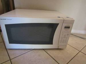 lot 110 image: Sharp carousel Microwave, white and its in used condition but works
