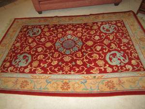 lot 102 image: Burgundy area rug 11269