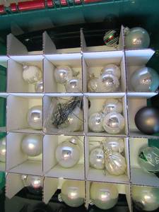 lot 360 image: Green tote full of various Christmas bulbs for tree dcor