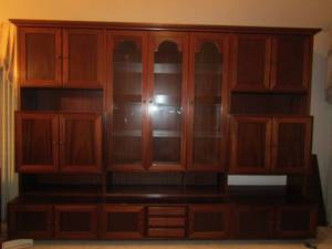 lot 1 image: LARGE Wall Entertainment Center, Cherry Wood, plenty of storage see pictures, 3 large glass doors in the center, 3 small drawers  Size  7 12FT  H  X 10 12FTL X 24D